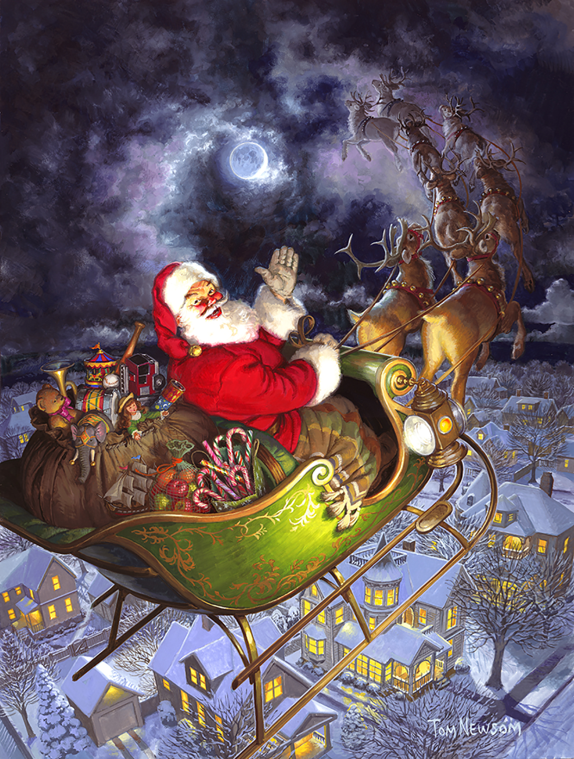 Santa flies over a village on his Christmas night journey!